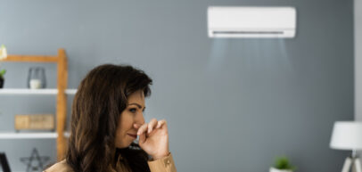 woman smelling odor from her ac sysytem